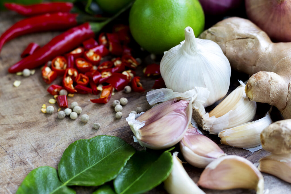 Food ingredient ginger ,chili pepper and garlic on wooden table, asian food cooking concept. stock photo