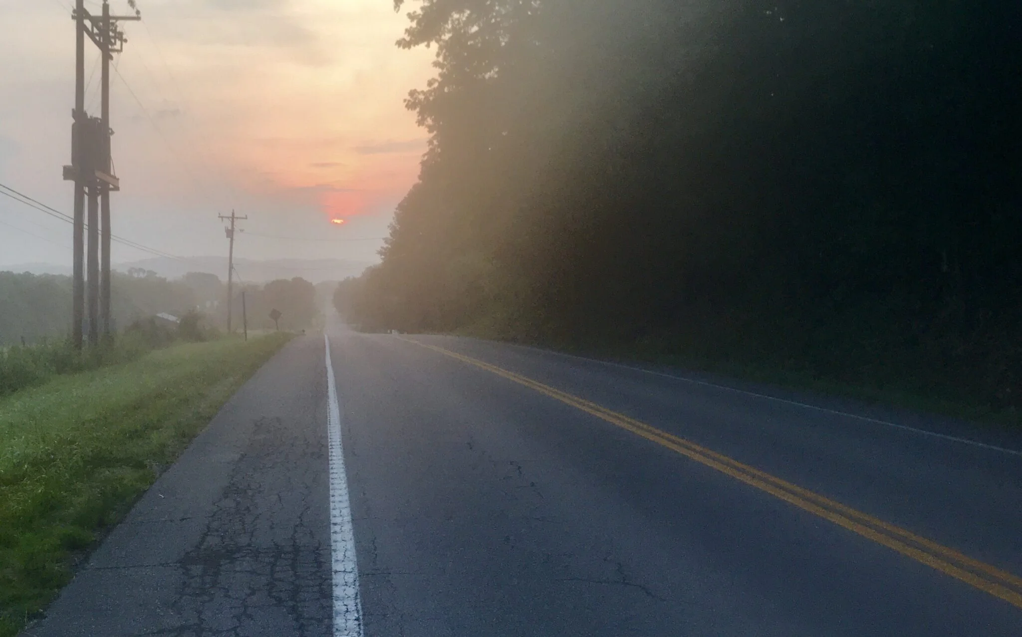 Picture of a long road in TN supporting the quote from Patrick Rothfus and tying it to past experiences.