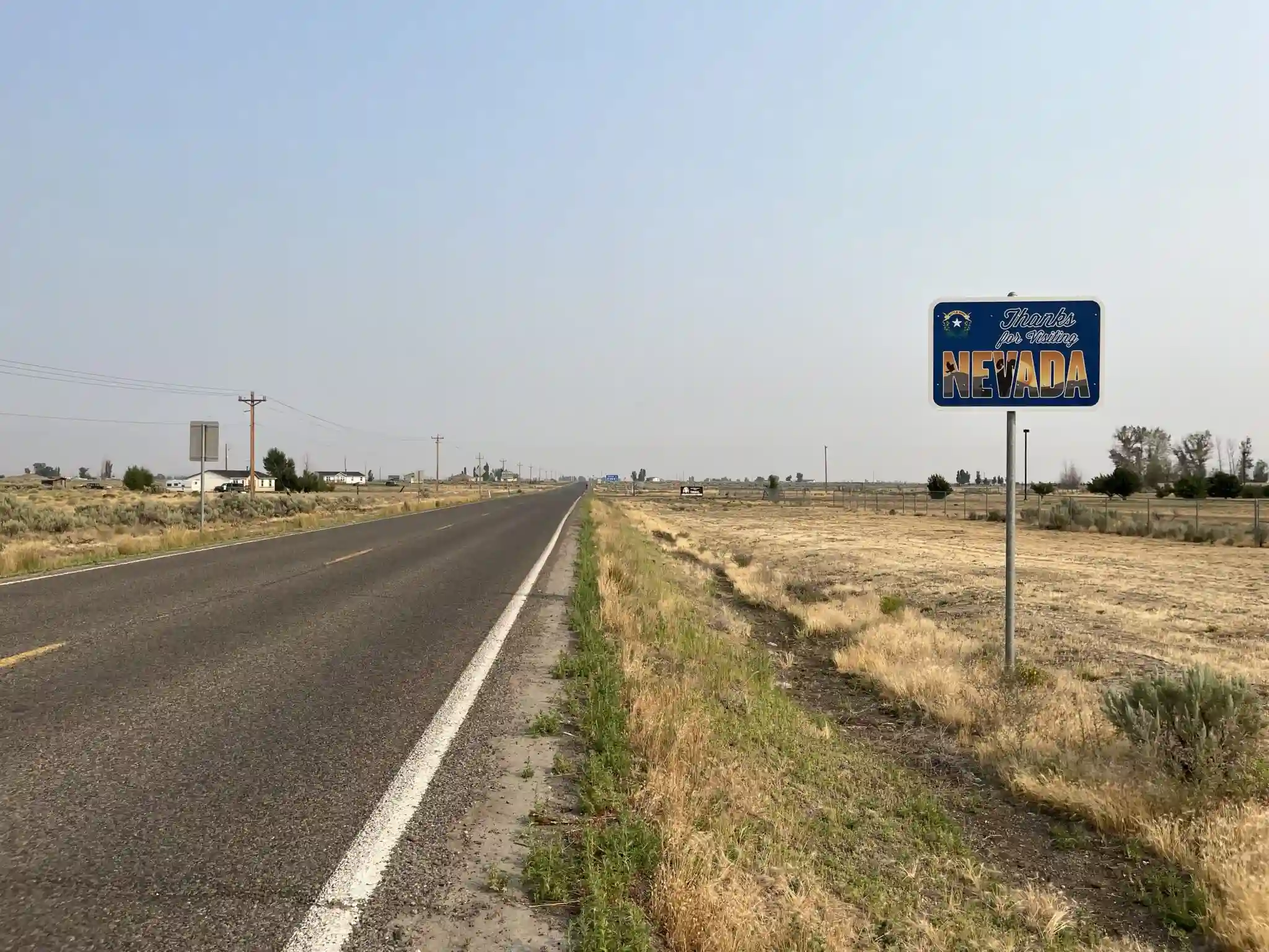 Thanks for visiting Nevada sign on a road