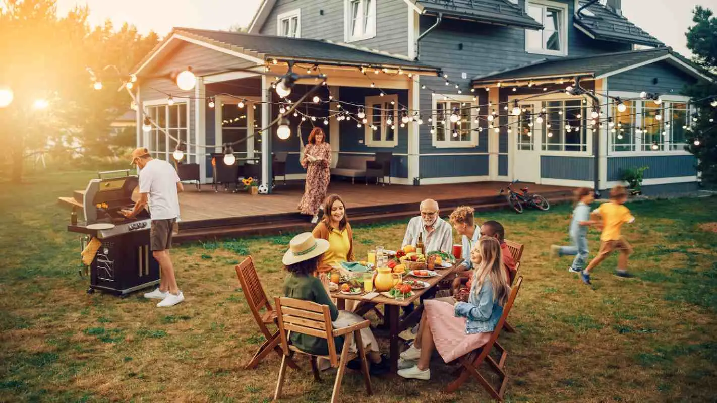 Family and Friends enjoying a backyard bbq on a warm sunny day.