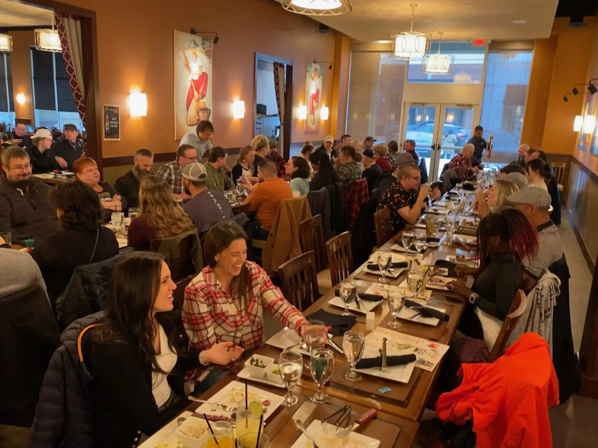 People dining at long tables